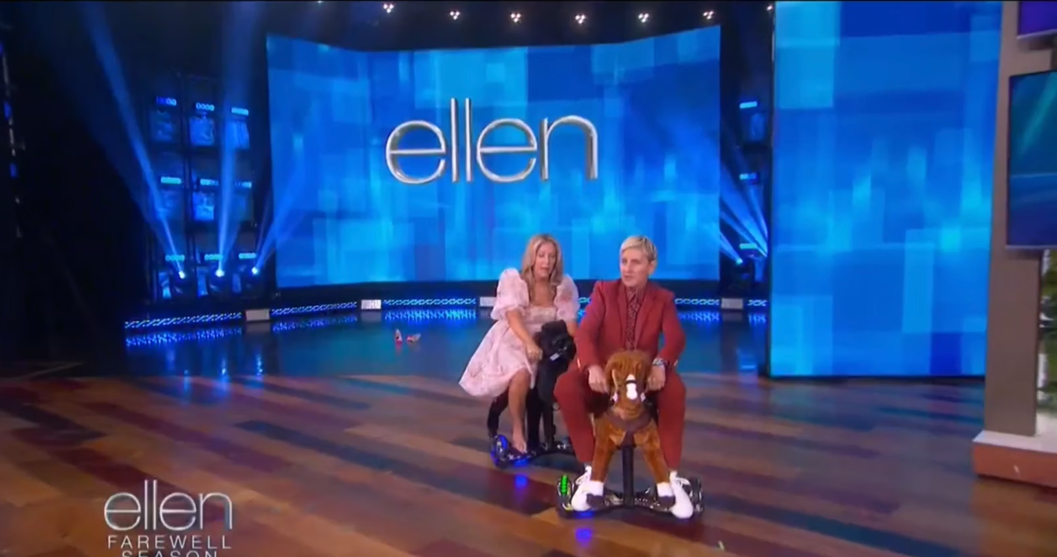 Ellen DeGeneres and guest riding Power Ponies on The Ellen Show stage during the farewell season.