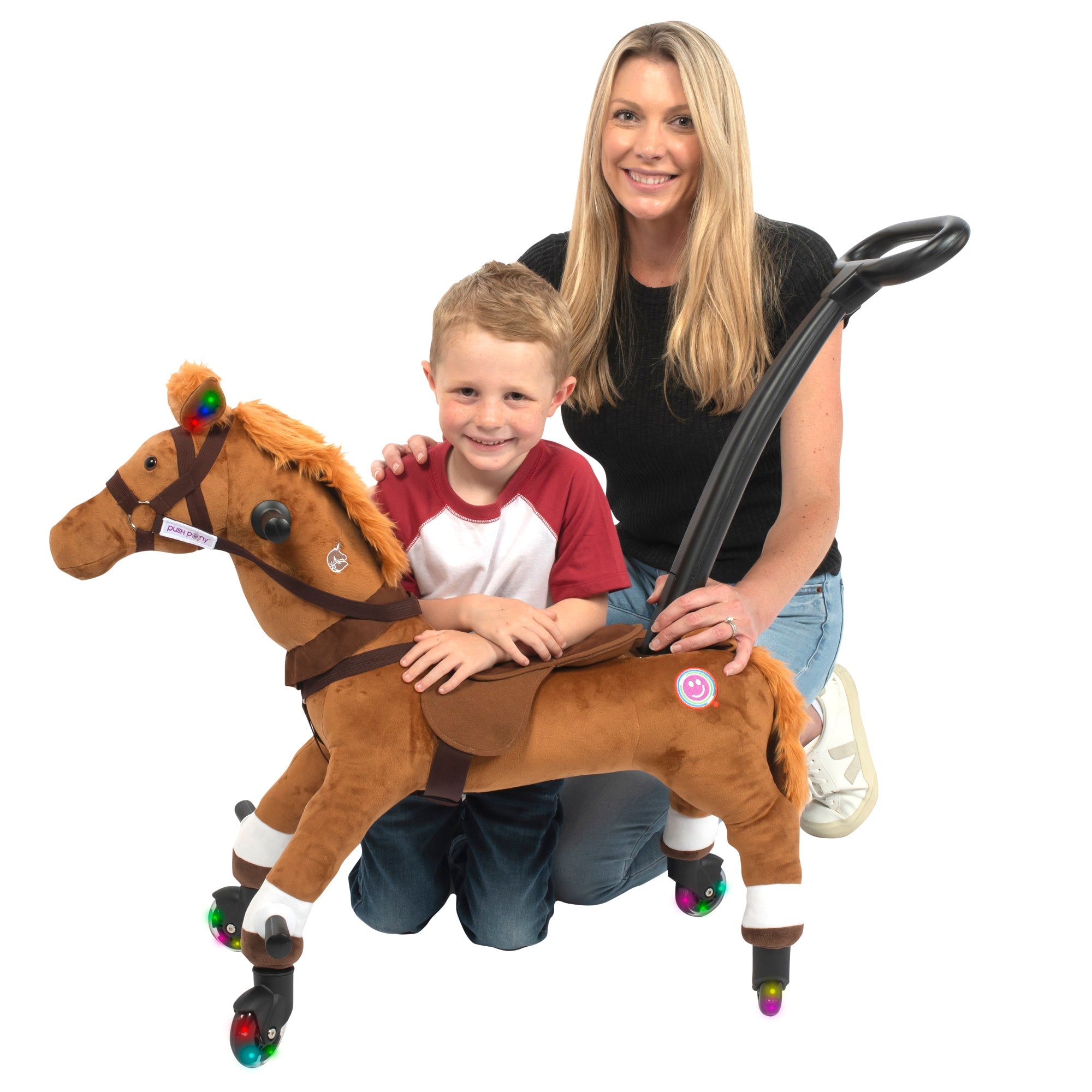 Smiling mom and son posing with a brown Push Pony, featuring handle and lights.